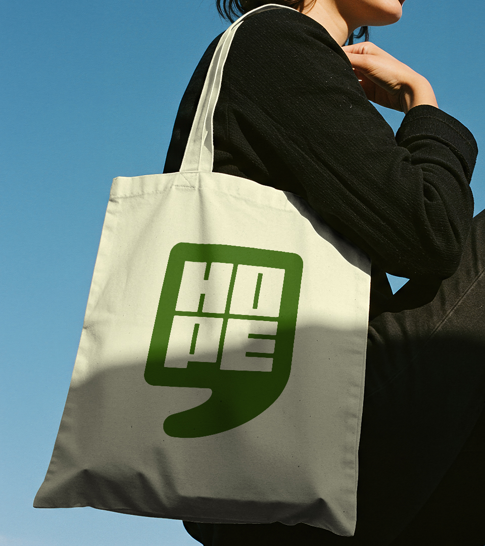 Image of a person carrying a Hope Theatre tote bag on their shoulder.