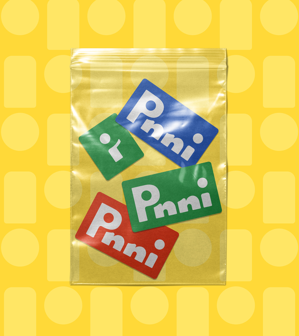 Mockup of a bag with Pinni stickers over yellow Pinni-branded pattern background.